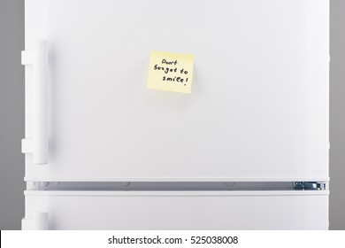 Dont Forget To Smile Note On Light Yellow Sticky Paper On White Refrigerator Door