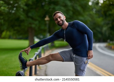 Dont Forget To Stretch. Cropped Portrait Of A Handsome Young Male Runner Warming Up Before His Workout.