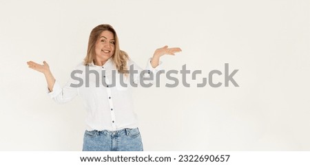 Don't know answer. Portrait of funny confused girl shrugging shoulders with clueless embarrassed expression, having doubts, not sure. Indoor studio shot isolated on white background