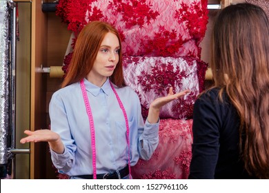 I Dont Know.bad Consultant Redhead Ginger Woman Cant Helping In Choice Of Interesting Cloth In Textile Shop To Client.