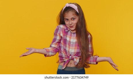 I Dont Know What To Say. Confused Preteen Child Girl Kid Feeling Embarrassed About Ambiguous Question, Having Doubts, No Idea Being Clueless And Uncertain. Little Toddler Children On Yellow Background