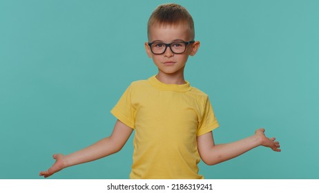 I Dont Know What To Say. Confused Little Toddler Children Boy Feeling Embarrassed About Ambiguous Question, Having Doubts, No Idea, Being Clueless And Uncertain. Young Preschool Kid On Blue Background