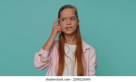 I Dont Know What To Say. Confused Pretty Teenager Young Girl Feeling Embarrassed About Ambiguous Question, Having Doubts, No Idea, Being Clueless And Uncertain. Student Child Kid On Blue Background