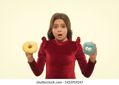 Dont Know Which To Eat First. Small Kid In Doughnut Bakery. Little Child With Funny Donuts. Adorable Small Girl In Bakery Shop. Girl Child Love Doughnuts. A Little Sweet Tooth. Bakery And Cafe.