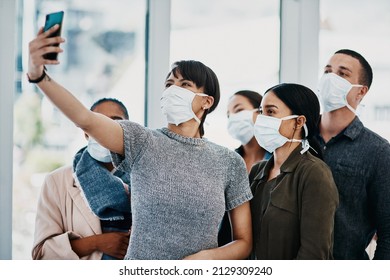 Dont Let Corona Compromise Your Camaraderie. Shot Of A Group Of Young People Wearing Masks And Taking Selfies At The Airport.