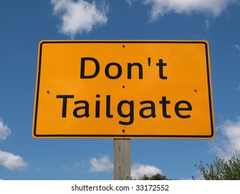 Don't Tail Gate Highway Sign On A Bright Sunny Day.