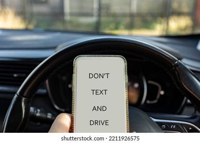 Dont Text And Drive, Mobile Phone Held Whilst Driving Car, Danger Concept, Copy Space