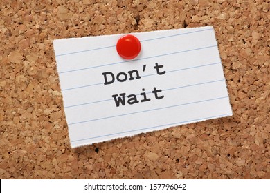 Don't Wait Typed Onto A Scrap Of Lined Paper And Pinned To A Cork Notice Board. A Call To Take Action And Get Things As Opposed To Wasting Time And Procrastination.