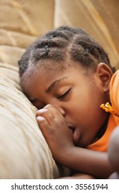 Don't Worry Be Happy, African Child With Braids Sleeping On The Couch