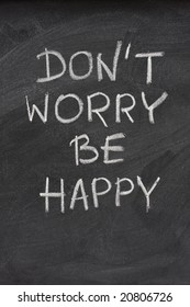 Don't Worry Be Happy Phrase, A Quote From Meher Baba, An Indian Mystic And Spiritual Master (before It Was Used In A Song Lyrics), Handwritten With White Chalk On  On Blackboard