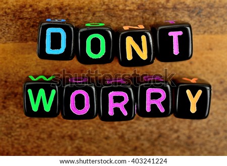 Dont worry on wood background