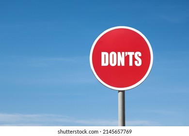 'Dont's' sign in red frame. Blue sky is on background