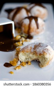 Donut Or Doughnut Holes, Deep Fried And Coated With Cinnamon, Powdered Sugar And Served With Vermont Maple Syrup And Crispy Bacon. Classic American Restaurant Breakfast Or Brunch Favorite.