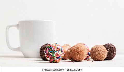 Donut Holes And Coffee On White Background