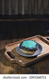 Donut With Mint Chocolate Topping, On Wooden Tray.  Selective Focus