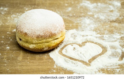 Donut Sprinkled With Icing Sugar. Heart Made Of Flour.