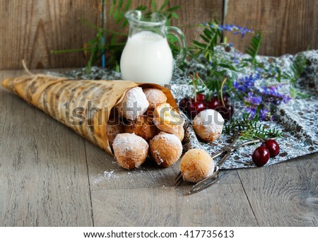 donuts balls, castagnoles italian with powdered sugar