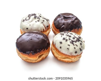 Donuts With Chocolate And Vanilla Glaze With Milk Chocolate Slices, Isolated On A White Background