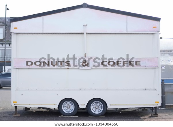 Donuts and coffee portable cabin
cafe trailer caravan selling refreshments at seaside beach
resort