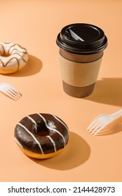 Donuts And A Glass Of Coffee On A Beige Background. Takeaway Food Concept.