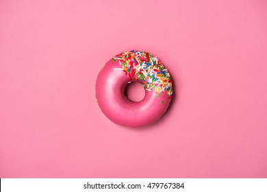 Donuts With Icing On Pastel Pink Background. Sweet Donuts.