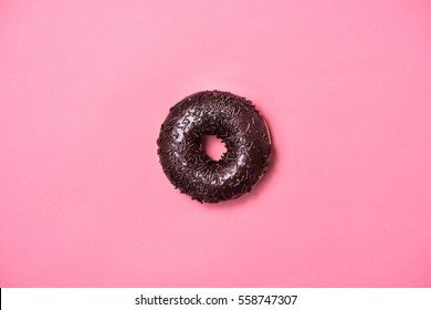 Donuts With Icing On Pastel Pink Background. Sweet Donuts.