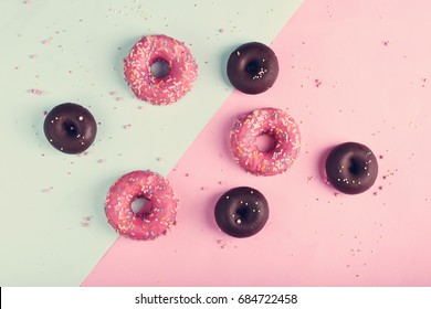 Donuts With Icing On Pastel Pink Background. Sweet Donuts.