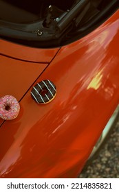 Donuts Lies On Red Car