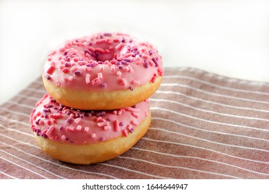 Donuts With Pink Icing And Marshmellow. Unhealthy Food Concept. Dougnuts On Thr Table