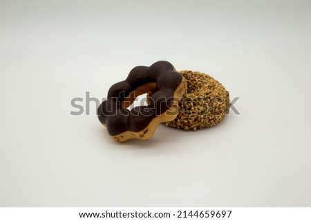 donuts, popular donuts, chocolate peanuts and pondering white choc.Include Clipping Path.
