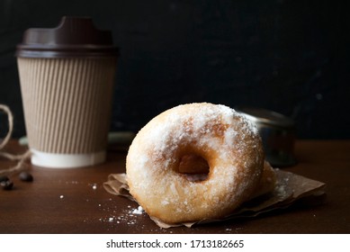 Donuts In Powdered Sugar. Gluten Free Home Made Rice Flour Donuts. Coffee To Go In A Paper Cup   On A Wooden Table.