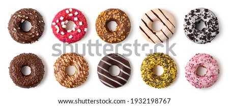 Donuts set with colorful sprinkles isolated on white background. Top view.