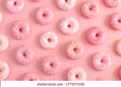 Donuts With Sprinkles On Pink Background. Sugar, Calories, Homemade Sweets Concept.