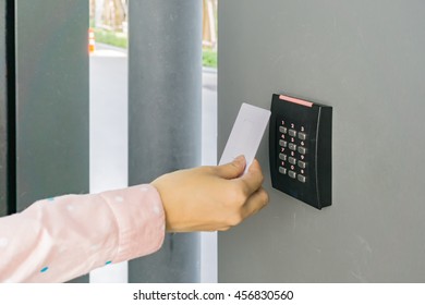 Door Access Control With A Hand Inserting Keycard To Lock And Unlock Door