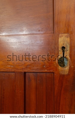 A door is being renovated, it has had its door handle removed during this process
