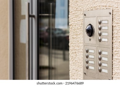 Door Bell Buttons With Microphone And Camera. Entrance Door With Modern Intercom System Of Apartment Building.