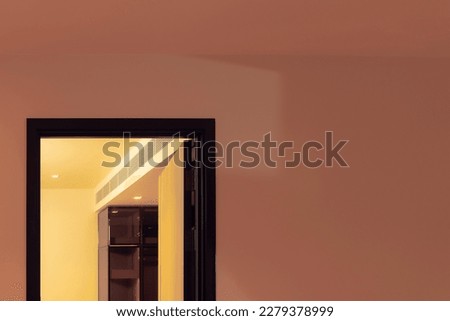 a door between pink and yellow room 