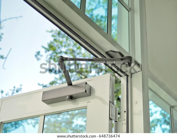 Door Closer On Modern Glass Door Stock Photo Edit Now