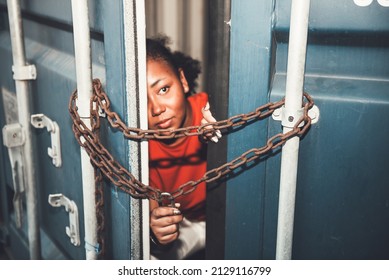 The door of a container which was covered with iron chains and keys, inside of which several African American woman, to human trafficking and illegal immigration concept. - Shutterstock ID 2129116799