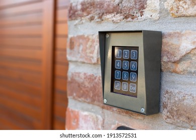 Door Entrance With A Modern Door Bell On The Wall