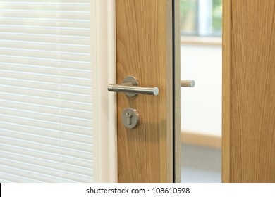 Door Focused On Handle To A Modern Office