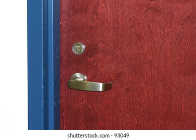 A Door Handle And Lock On The Door To A Room.