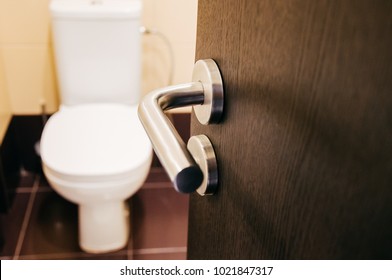 Door handle open to toilet can see toilet