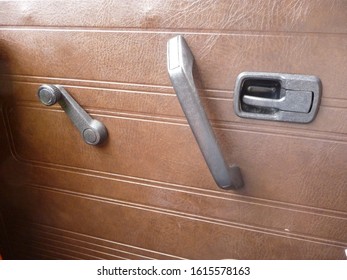 Door Handle And Window Crank In One Car