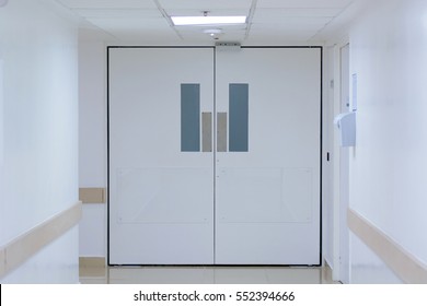 The Door To The Hospital In A White Hallway