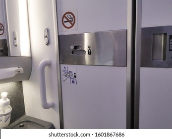 Door from Inside Airplane lavatory .Small space  Inside the airplane toilet - Shutterstock ID 1601867686