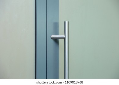 Door Joinery Made Of Aluminum Frame And With A Glass Filling With A Sticker That Makes The Rail Opaque And Gives A White Milky Color.
