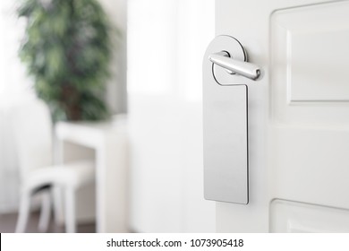 Door Knob With Empty Label On A Door Handle For Your Text. Empty White Flyer Mockup Hang On Door Handle. Leaflet Design On Entrance Doorknob. Dont Disturb Sign. Hotel Room Clear Hanger. Blank