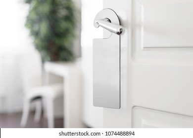 Door Knob With Empty Label On A Door Handle For Your Text. Empty White Flyer Mockup Hang On Door Handle. Leaflet Design On Entrance Doorknob. Dont Disturb Sign. Hotel Room Clear Hanger. Blank