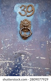 A door knocker is a device fixed to a door that allows people outside to alert those inside by making a noise when it is struck. It typically consists of a metal part that is lifted and used to hit a plate or the door itself.
